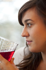 Young Woman Drinking Cranberry Juice