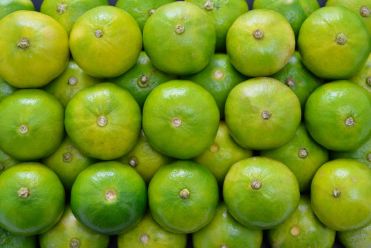 Stack of fresh lime fruits(green lemon)