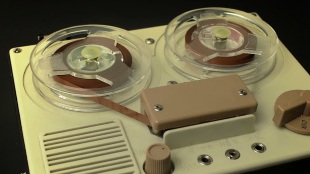 stop-motion of a small vintage reel to reel tape recorder