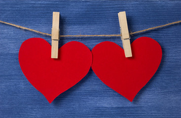 Two paper hearts hanging on a rope