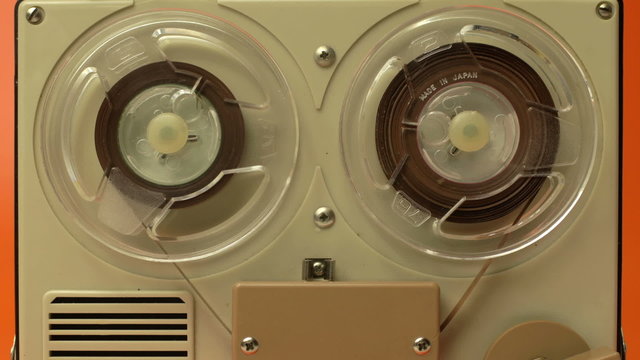 stop-motion of a small vintage reel to reel tape recorder