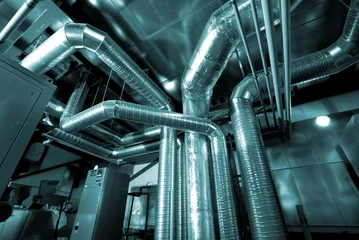 Store enrouleur tamisant Bâtiment industriel Ventilation pipes of an air condition