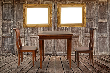 Fototapeta premium Vintage photo frame and furniture in wooden room