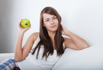 Beautiful young girl with apple