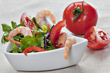 Close up of green watercress salad with tiger prawns