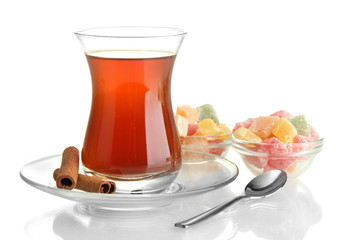 glass of Turkish tea and rahat Delight, isolated on white