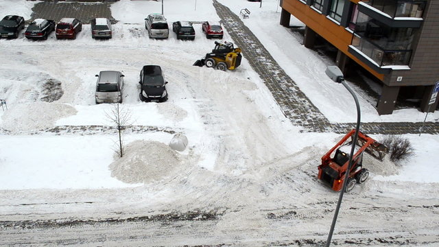 cars stand block house parking tractors clean winter snow