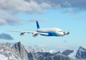 White passenger plane above the mountains