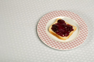 Spread jam on bread