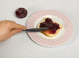 Spread jam on bread