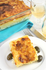 codfish with potato and sour cream on the plate