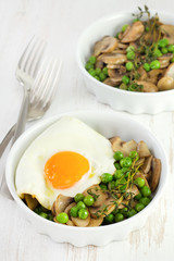 fried egg with peas and champignon