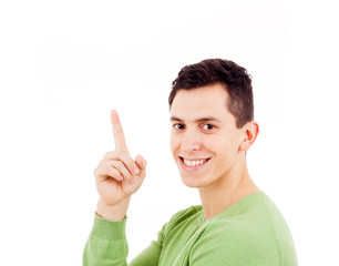 Portrait of happy young casual man pointing over white backgroun