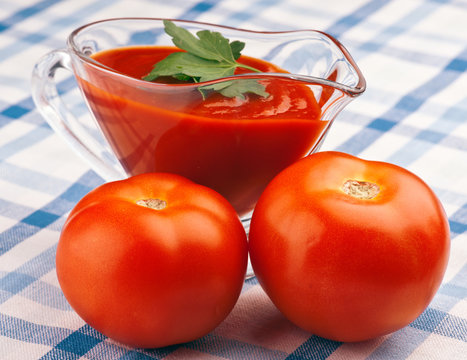 homemade sauce of fresh tomatoes, on rustic tablecloth