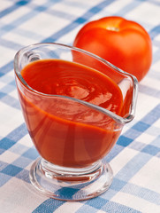 homemade sauce of fresh tomatoes, on rustic tablecloth