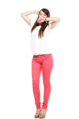 Fototapeta premium Beautiful woman in red standing yawning stretching 
