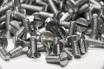 Macro shot of screws on white