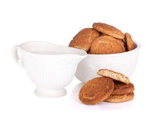 Bowl with cookies and milk