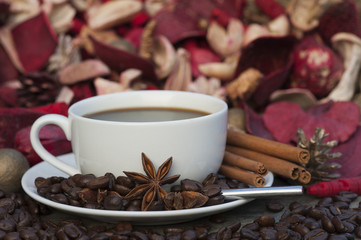 Steaming hot cup of coffee on Christmas background