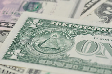 Detail of one dollar bill with selective focus.