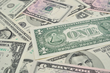 Dollar banknotes as background.