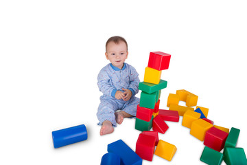 child playing with plastic blocks and cubes