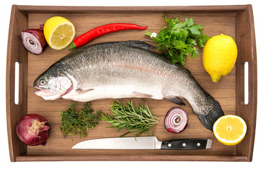 raw salmon trout fish on wooden background