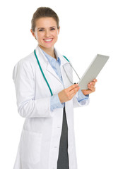 Smiling medical doctor woman with tablet PC