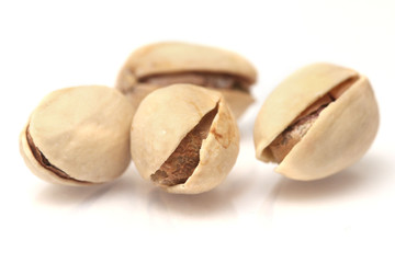  toasted pistachios on a white background 