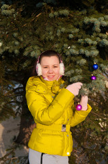 girl decorating christmas tree