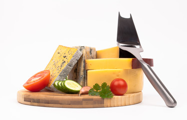 Various types of cheese and vegetables isolated on white