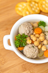 Chicpeas soup with meatballs and vegetables