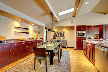 Luxury modern dining room with mahogany kitchen.