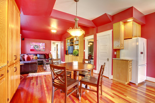 Red beautiful large kitchen with cherry hardwood.