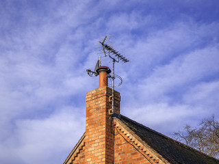 A satellite dish and TV arial