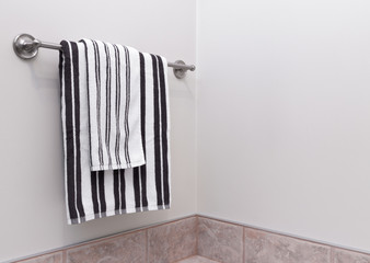 Stripped bathroom towels on towel holder