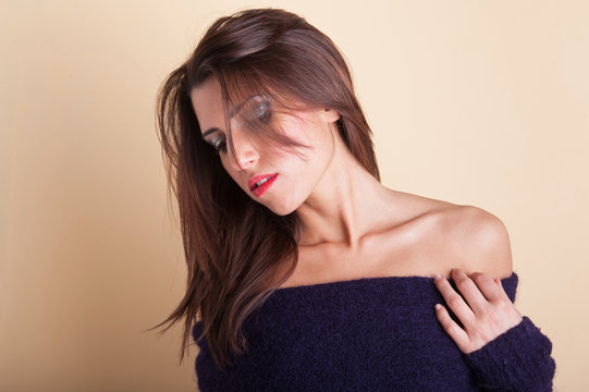 Woman portrait with purple sweater and red lipstick 