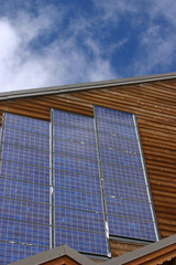 Fototapeta na wymiar Chalet with solar panels - Vertical