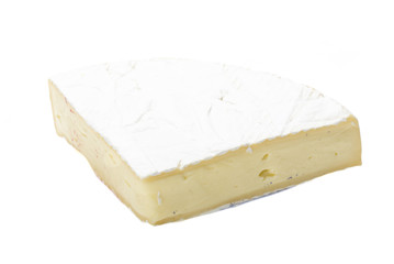 A piece of soft brie cheese