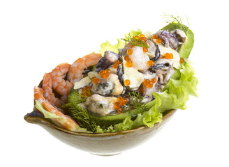 Seafood salad with red caviar in avocado