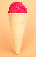 Scoop of the strawberry ice cream in the waffle cone