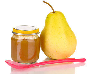 Useful and tasty baby food with pear and spoon isolated on