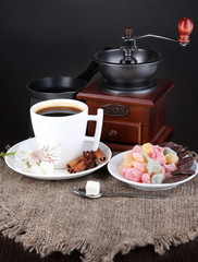 White cup of Turkish coffee with rahat delight, coffee pot and