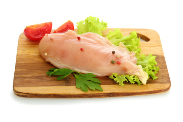 raw chicken meat on cutting board, isolated on white