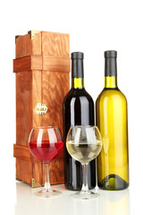 Wooden case with wine bottles isolated on white