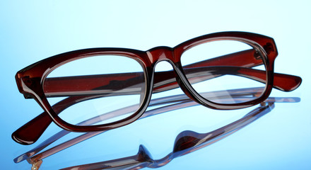 Beautiful glasses on blue background