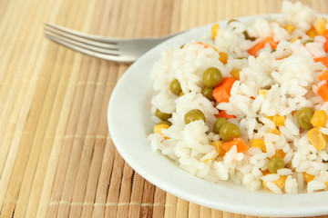 Risotto on plate on light background