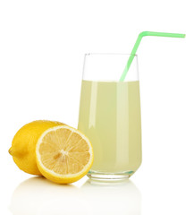 Delicious lemon juice in glass and lemons next to it isolated
