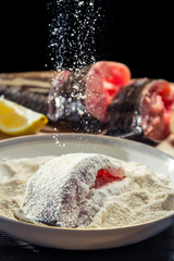 Close-up on fresh fish sprinkled flour