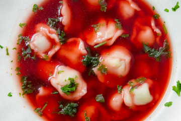 Close-up of a plate of borscht with dumplings